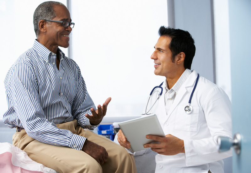 Male-patient-explaining-symptoms-to-physician
